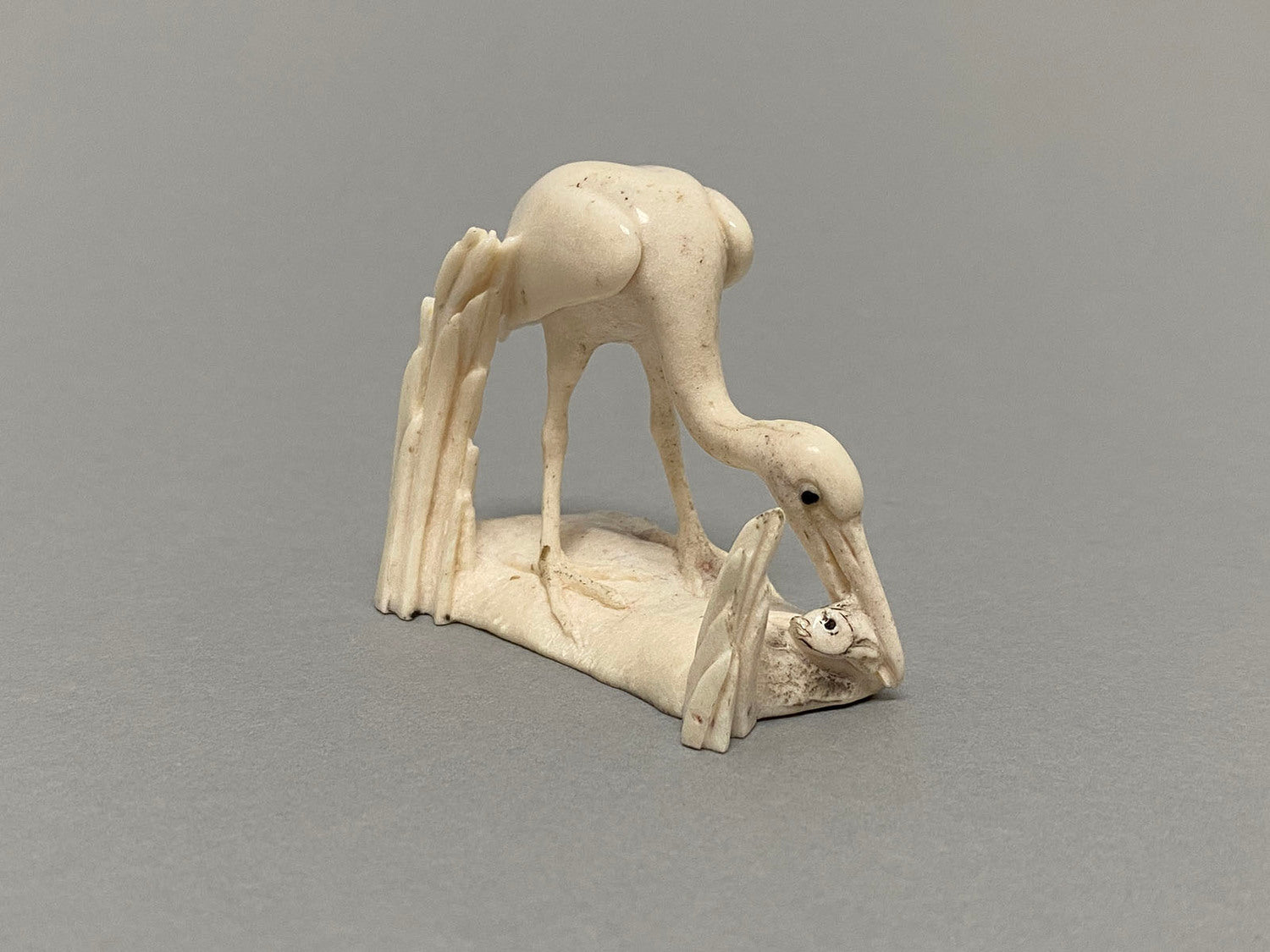 Egret with Fish and Two Frogs